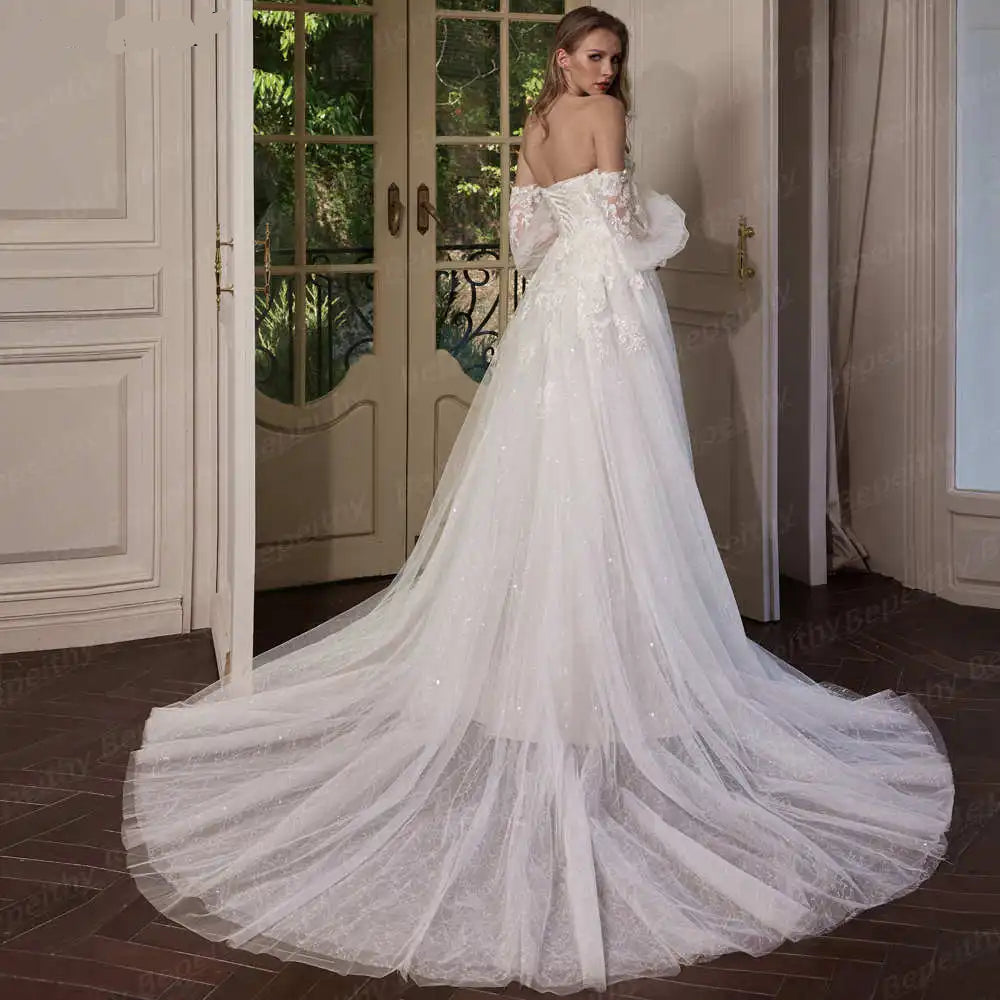 White wedding dress with a long train in an elegant indoor setting