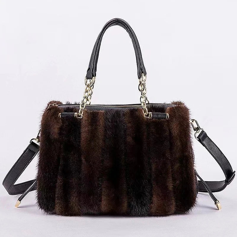 Turquoise fur handbag with gold chain handle on a light gray background, featuring the brand 'QIMING'.