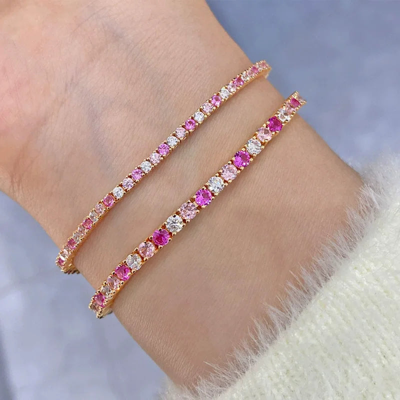 Gold bracelet with pink and White stones on a White background, featuring the wuha brand.