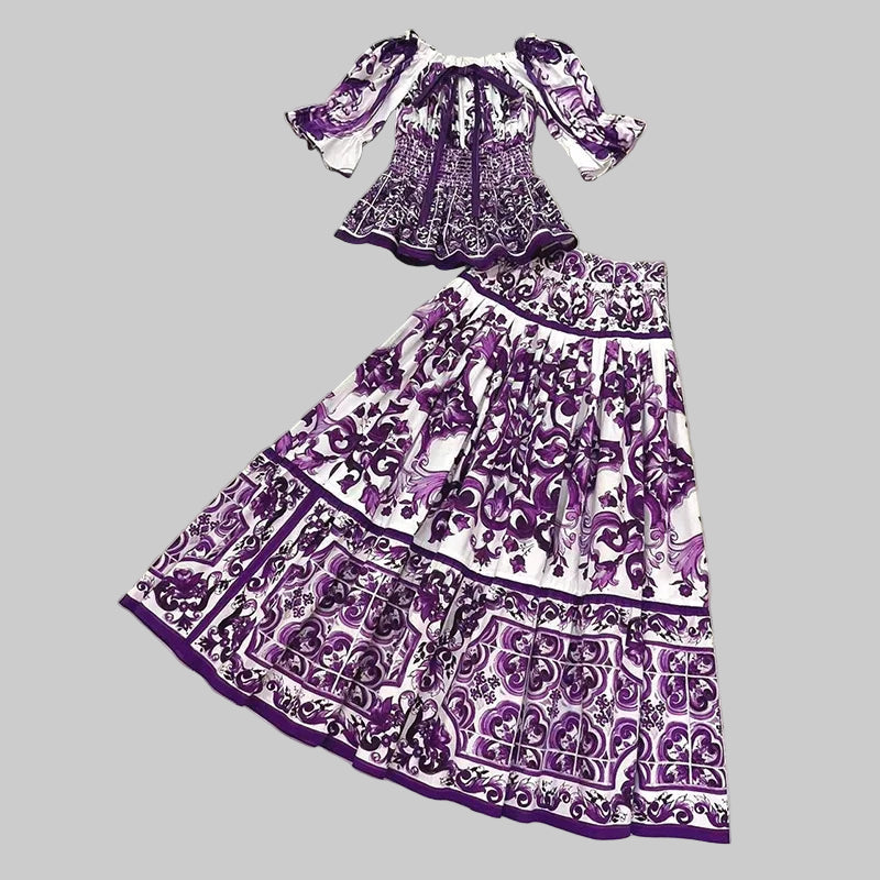 Purple and white patterned dress on a marble floor with 'Seifrmann' branding.