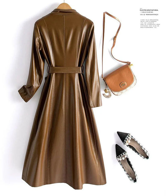 Green leather coat with a brown handbag and black shoes on a white background - HER SHOP