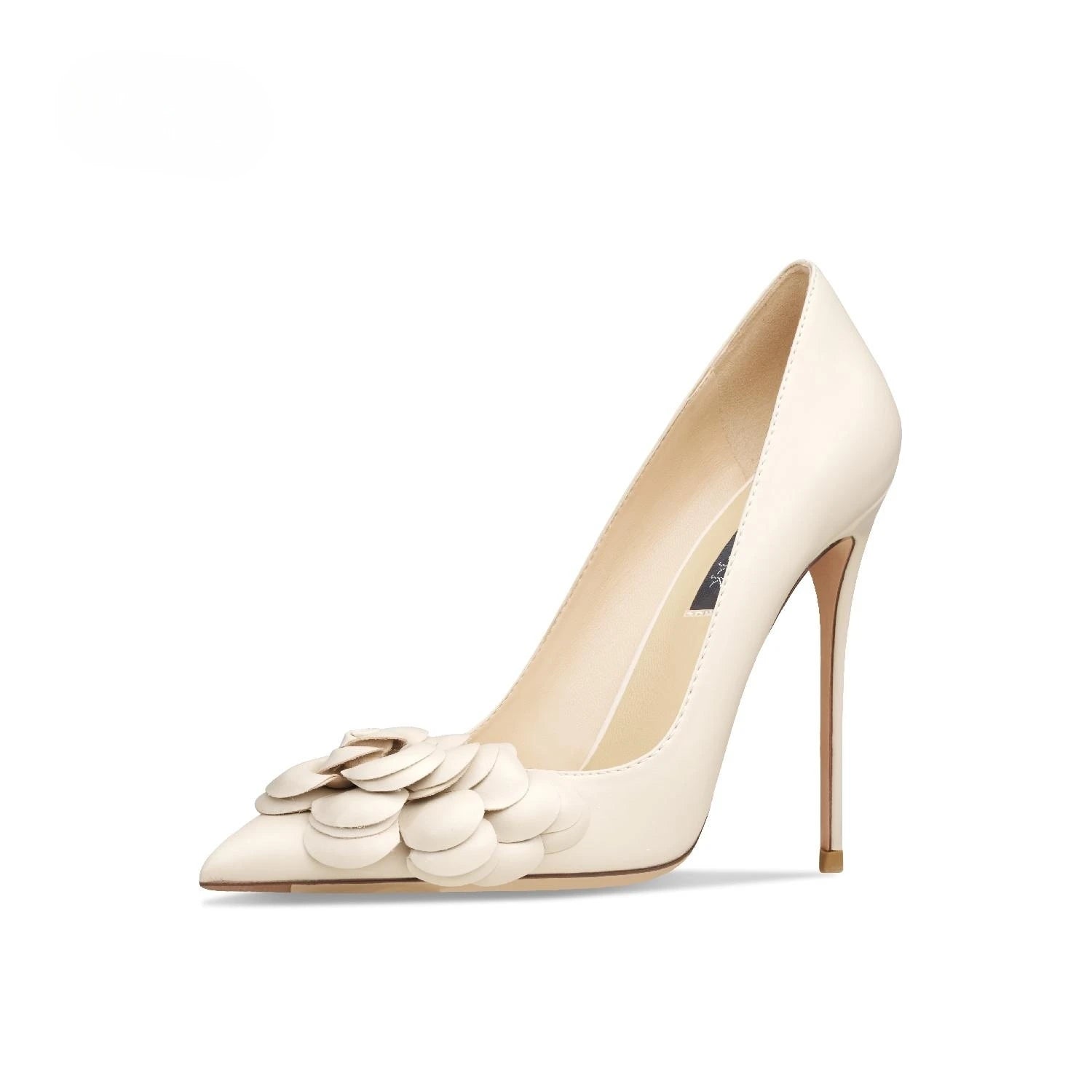 Pair of cream high-heeled shoes with floral details on a white background