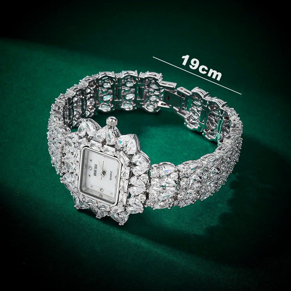 Silver bracelet with diamond-like stones on a green background