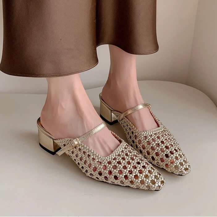 Gold open-toe shoes with a decorative pattern worn by a person, on a neutral background with Dilalula branding.