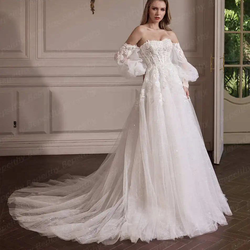 Woman in a white wedding dress with a long train in an elegant room.