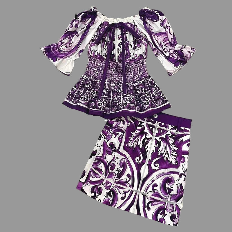 Purple and white patterned top and skirt set on a tiled floor with 'Seifrmann' branding.