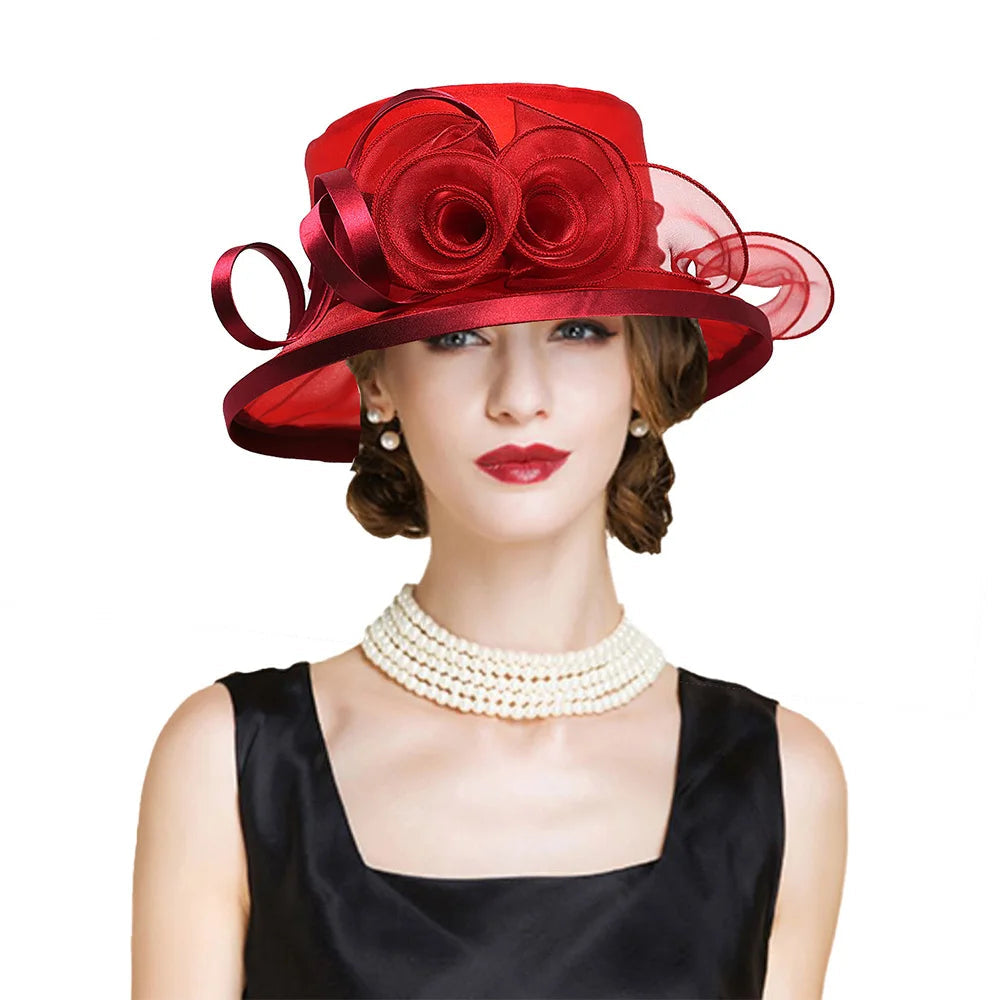 Woman wearing a red hat with floral details on a white background