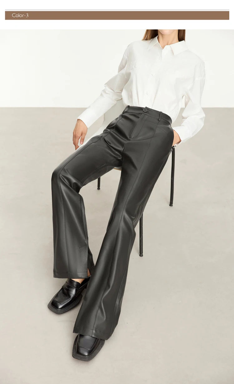 Person wearing black wide-leg pants and a white shirt on a gray background with 'Amii' branding.
