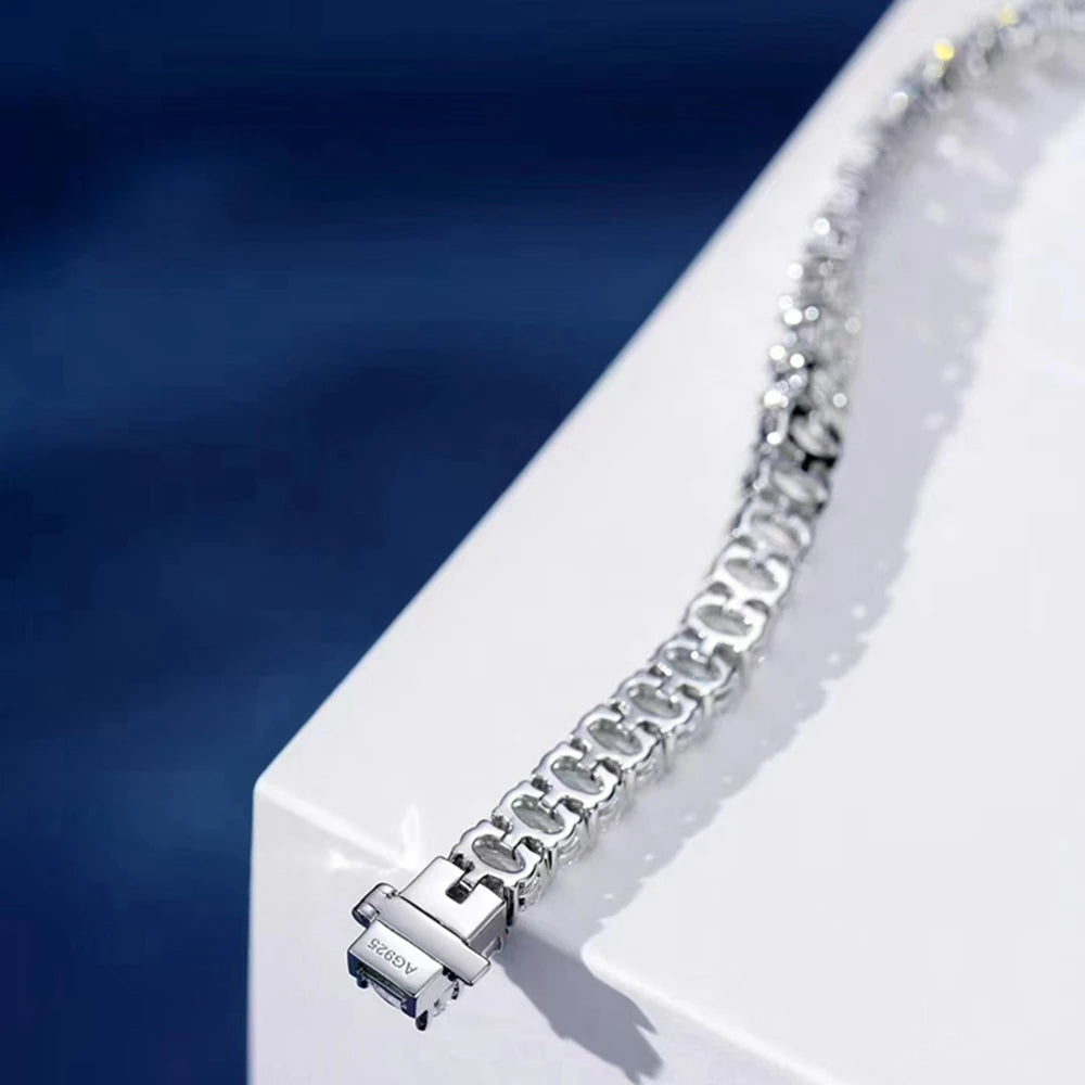 Silver bracelet with clear stones on a White background, featuring the Wuiha brand.