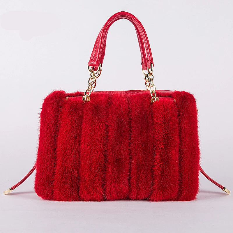 Turquoise fur handbag with gold chain handle on a light gray background, featuring the brand 'QIMING'.