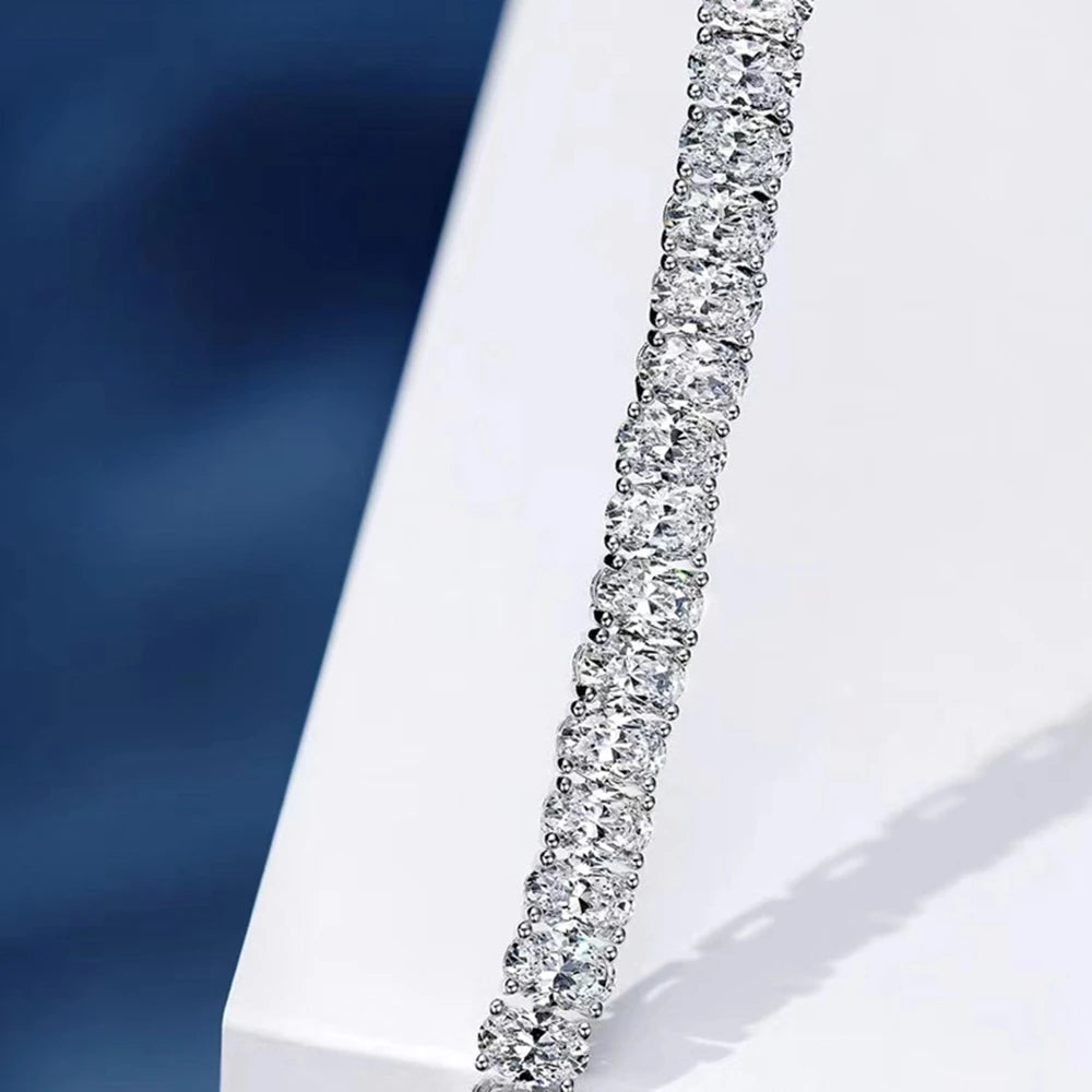 Silver bracelet with clear stones on a White background, featuring the Wuiha brand.