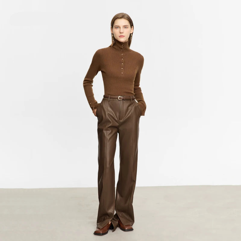 Woman wearing a brown outfit with a high collar and wide-leg pants on a white background, featuring the AMII brand.