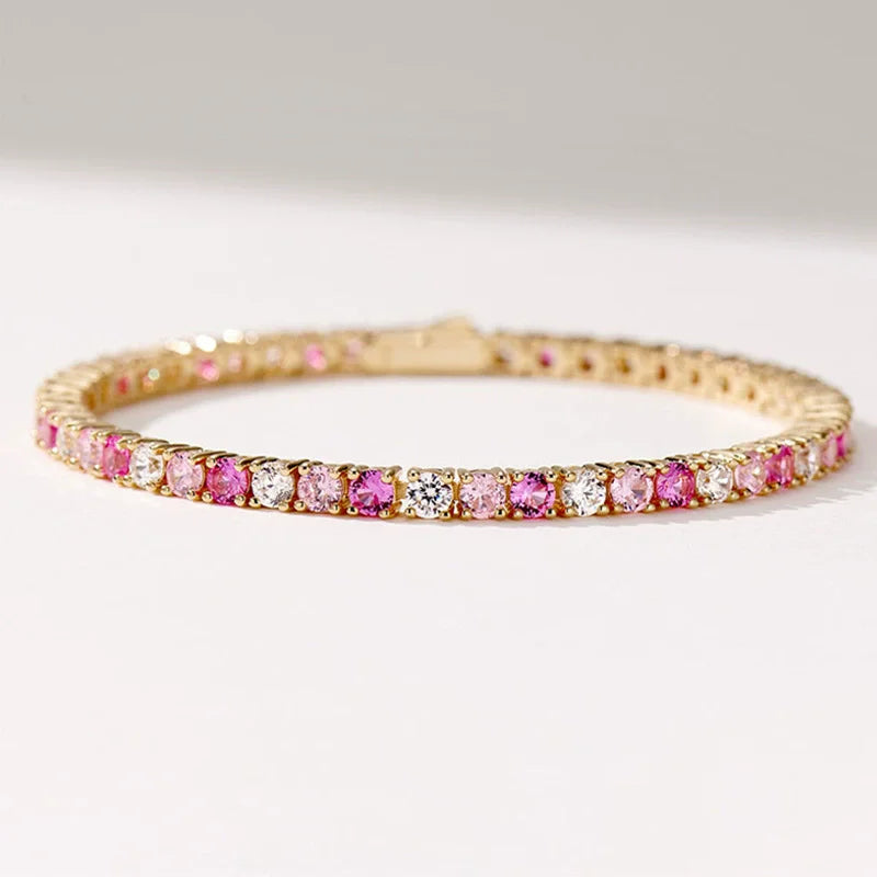 Gold bracelet with pink and White stones on a White background, featuring the wuha brand.