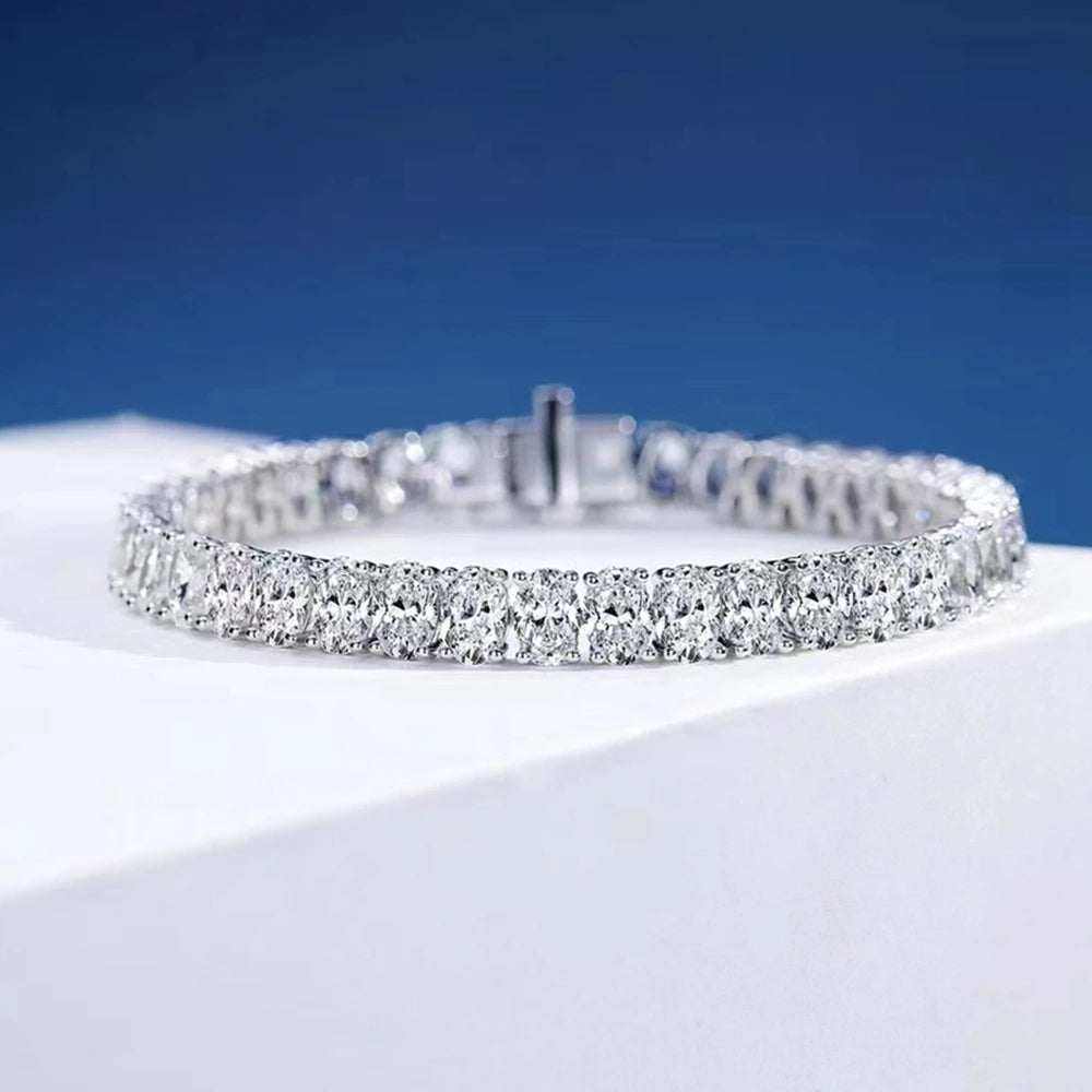 Silver bracelet with clear stones on a White background, featuring the Wuiha brand.
