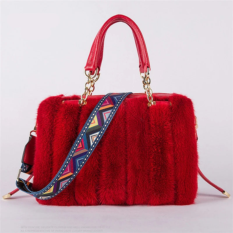 Red fur handbag with a colorful strap on a light gray background, featuring the brand 'Qiming'.