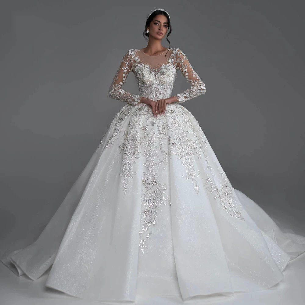 Bride wearing an elegant modest long sleeve wedding dress — HER SHOP®