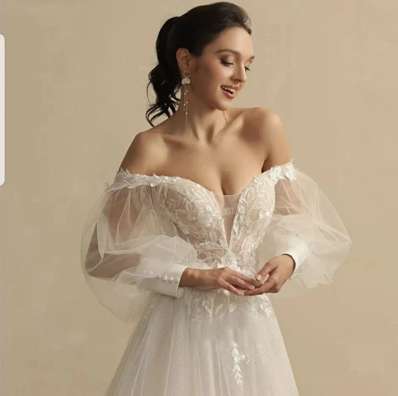 Off-the-Shoulder V-Neck A-Line Wedding Dress – Puff Sleeves & Lace — bridal gown photograph