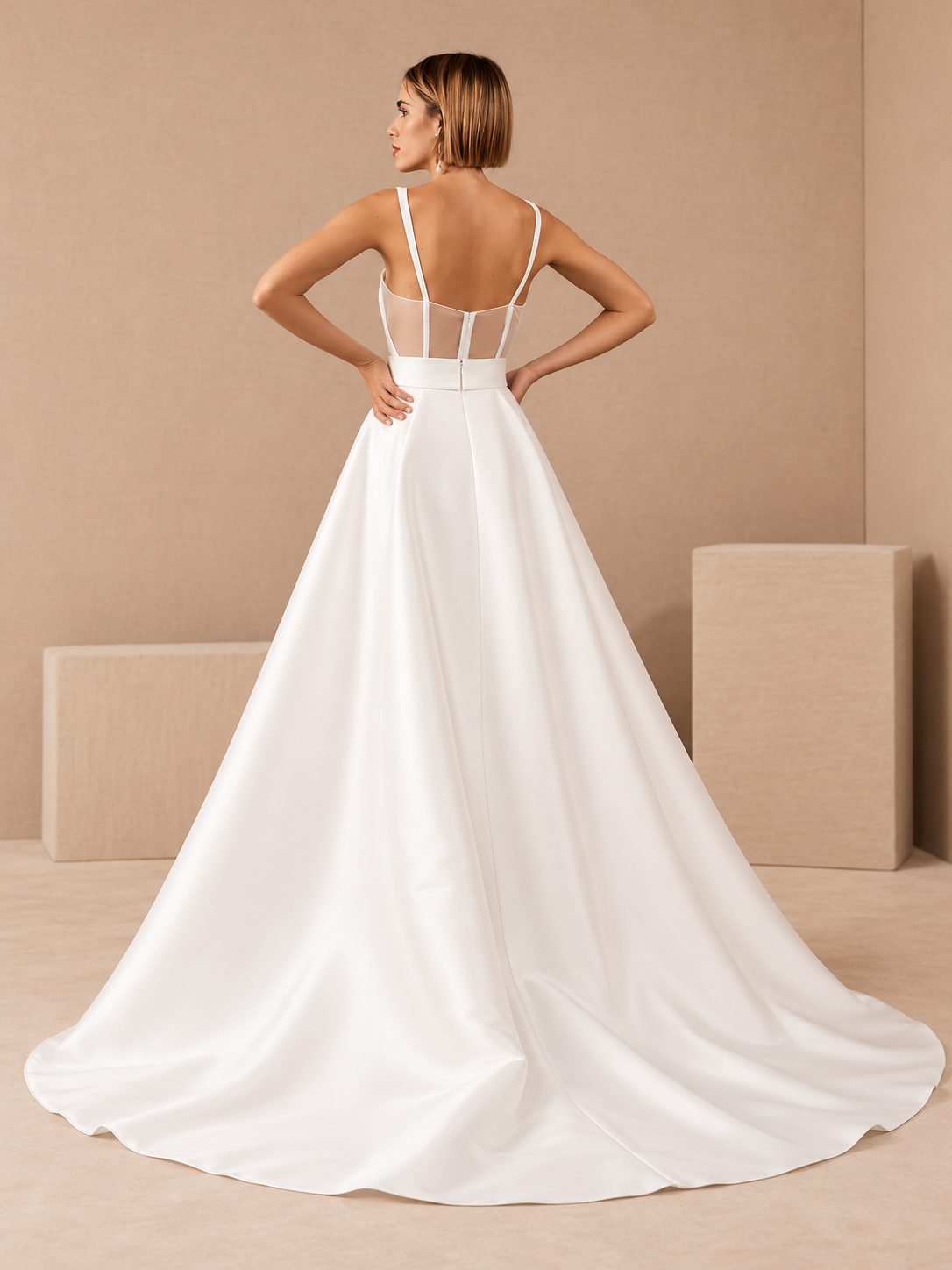 Back view of two-piece bridal jumpsuit with detachable satin wedding overskirt