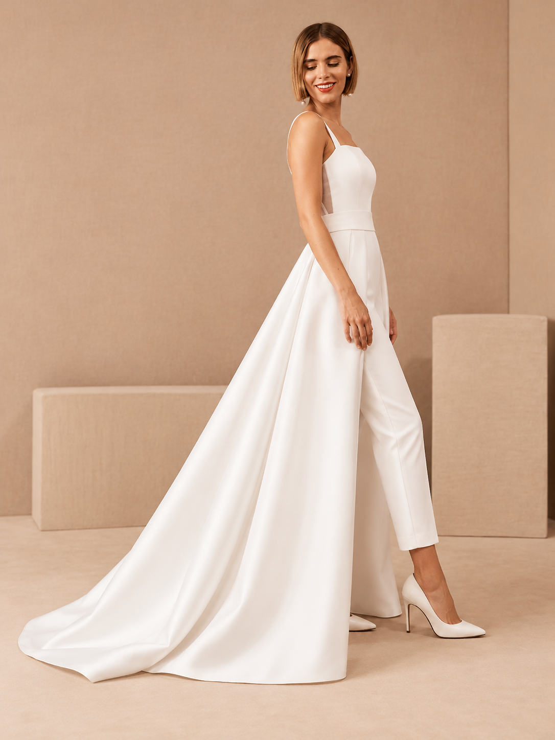 Side view of elegant wedding jumpsuit with flowing removable satin overskirt