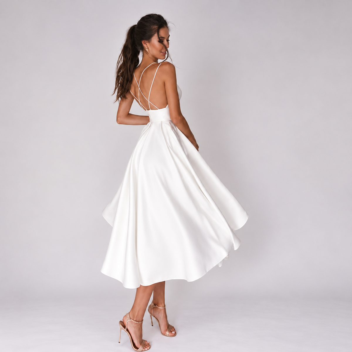 Open back detail of short white satin beach wedding dress