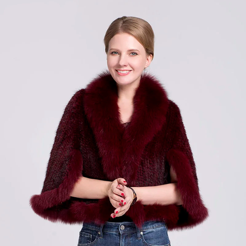 Woman wearing a burgundy fur coat with a plain background