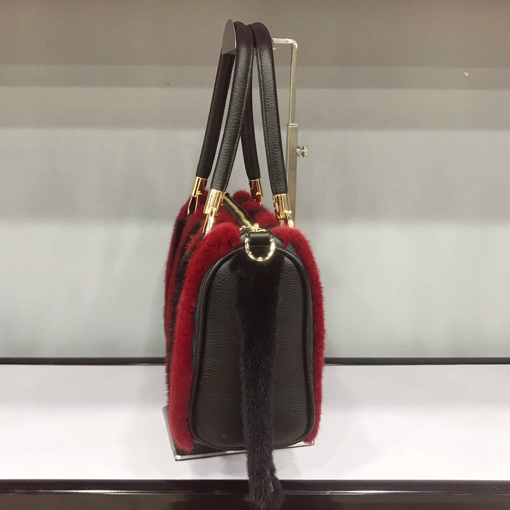 White fur handbag with brown handles on a stand, branded 'LLHPB FUR'.