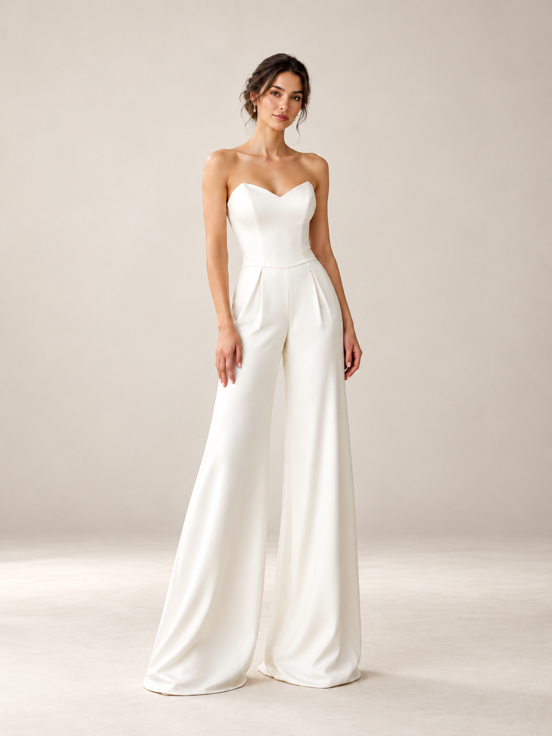 Minimalist strapless bridal jumpsuit with sweetheart neckline and wide-leg pants – front view