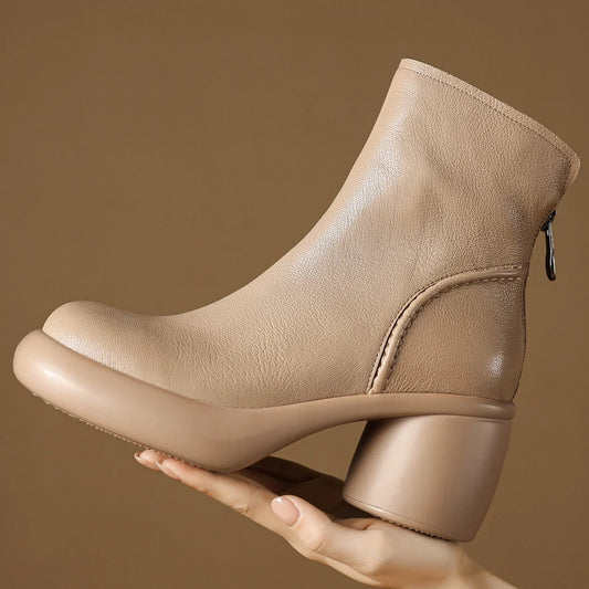 Beige ankle boots on a textured brown surface - HER SHOP