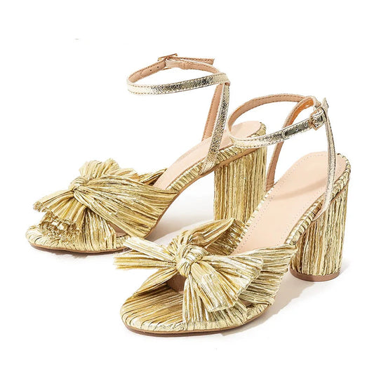 Pink high-heeled sandals with ruffled details on a white background, featuring the brand 'Voesnees'. - HER SHOP