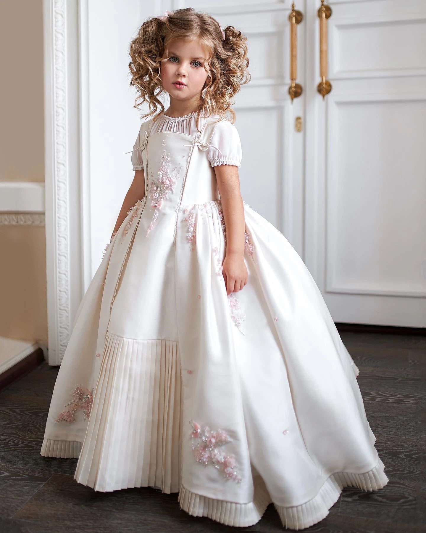 Young girl in a white embroidered dress standing indoors. - HER SHOP