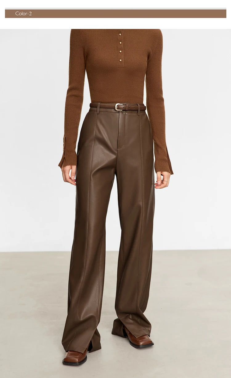 Person wearing black wide-leg pants and a white shirt on a gray background with 'Amii' branding.