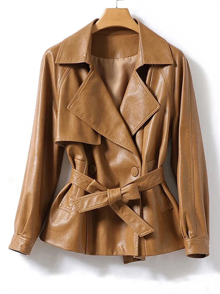 Brown leather jacket with a belt on a hanger against a white background, branded 'JulyPalette'.