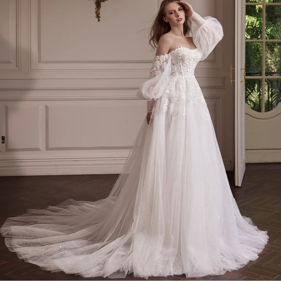 Woman in a white wedding dress with a long train in an elegant room. - HER SHOP