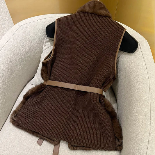 Beige fur vest with a belt on a chair - HER SHOP