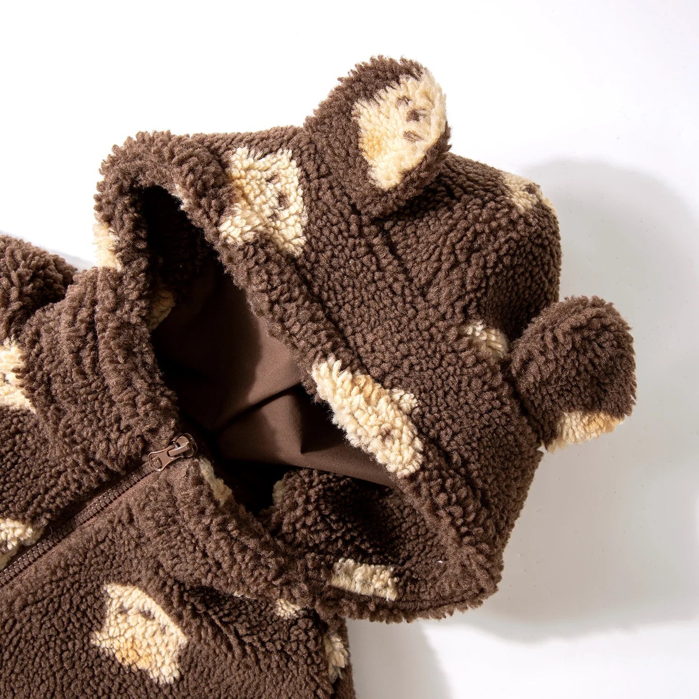 Brown teddy bear-shaped robe with beige accents on a white background, featuring the Amila brand logo.