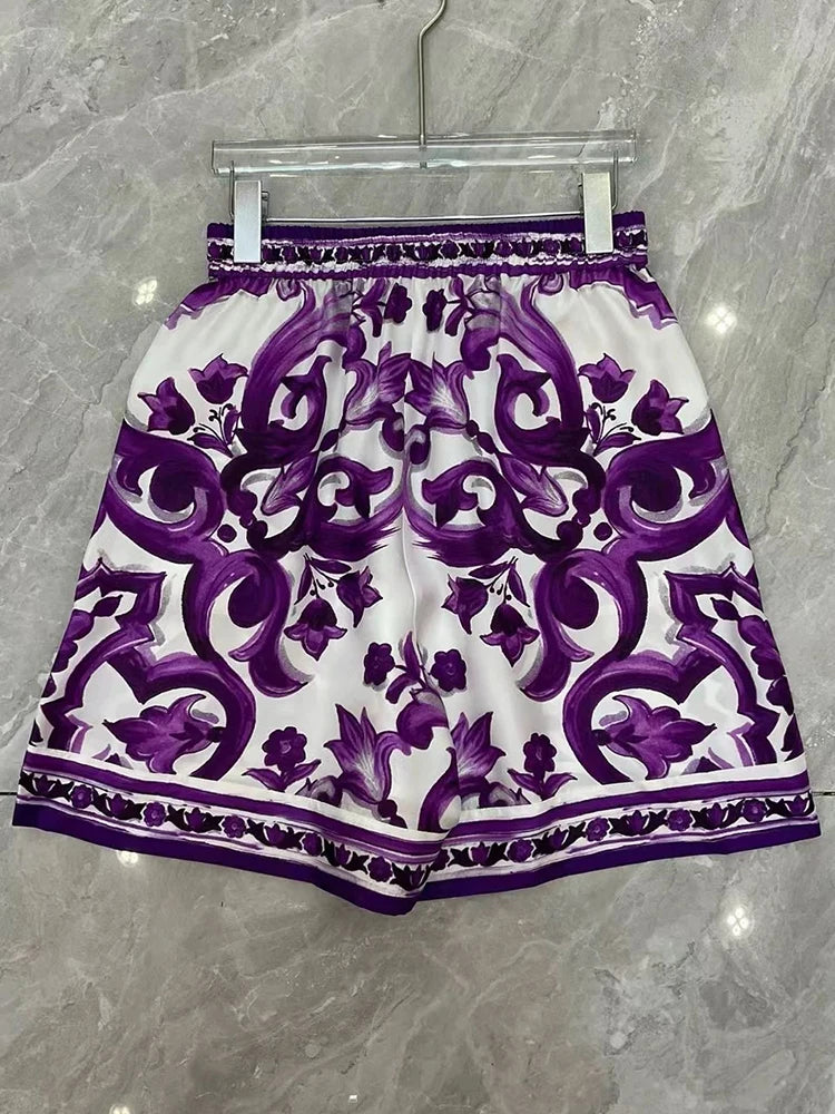 Purple and White patterned dress on a mannequin against a White background