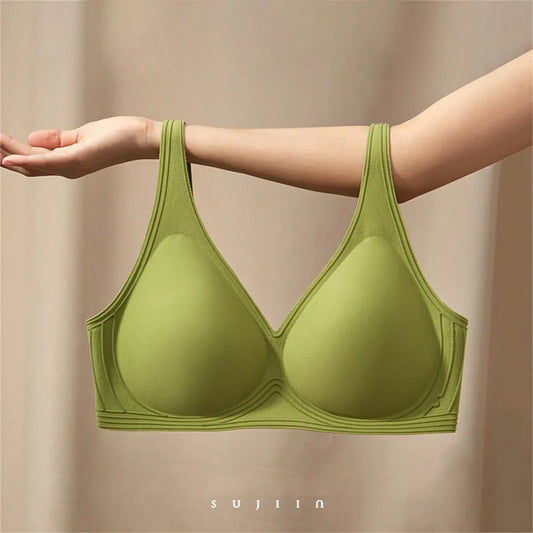 Woman wearing a peach-colored bra with a plain background and 'Sajiin' brand logo. - HER SHOP