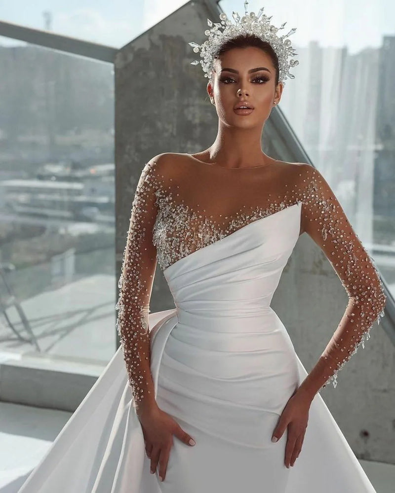 Elegant Mermaid Wedding Dress with Illusion Neckline, Beaded Long Sleeves, and a Detachable Overskirt