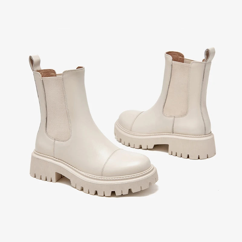 White chunky boots on a white background with 'BEAU TODAY' branding.