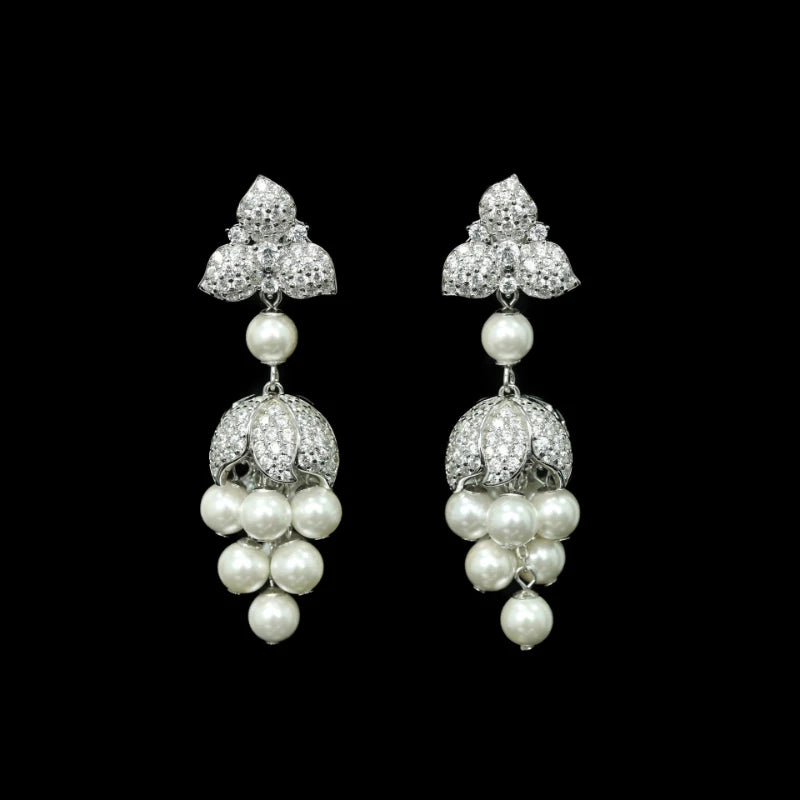 Pair of silver earrings with pearl drops on a black background - HER SHOP
