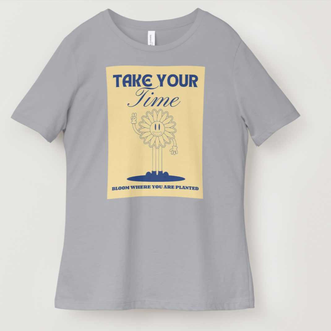 Gray t-shirt with a graphic design featuring a sunflower and text on a beige background