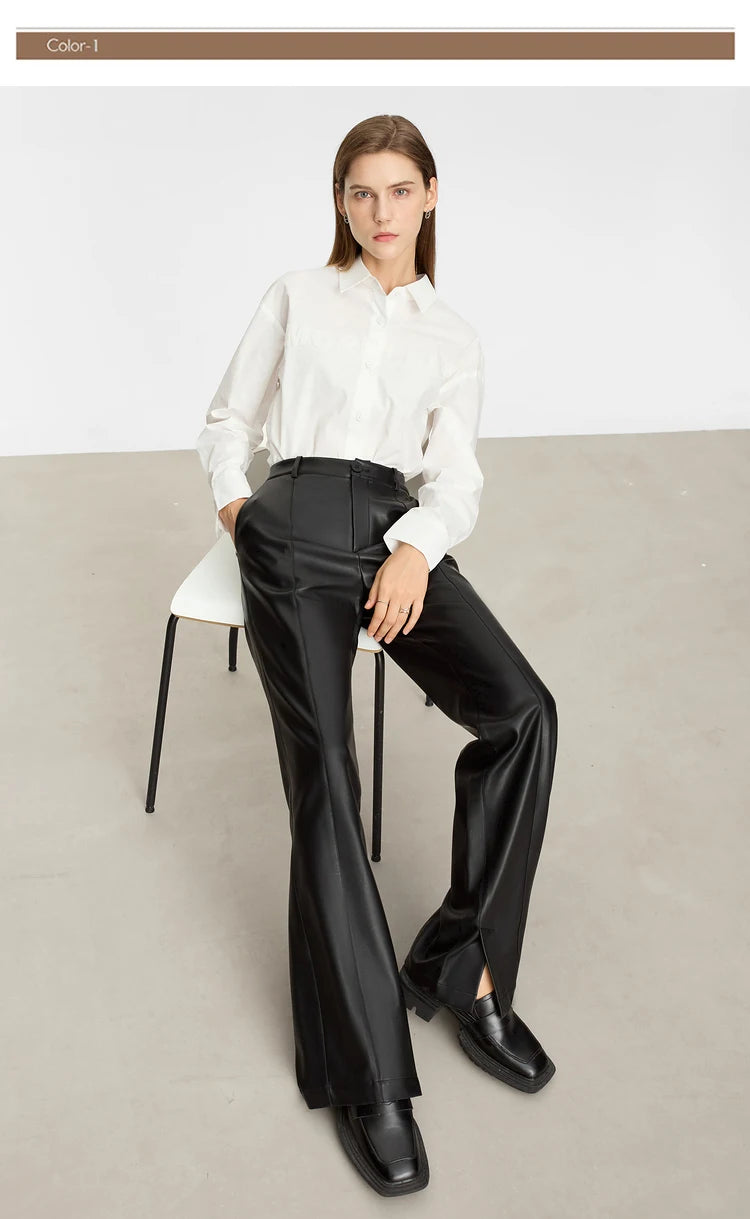 Person wearing black wide-leg pants and a white shirt on a gray background with 'Amii' branding.